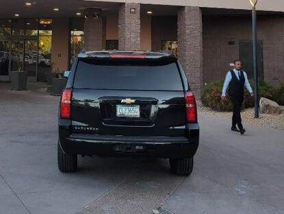 Private Driver next to Chevy Suburban